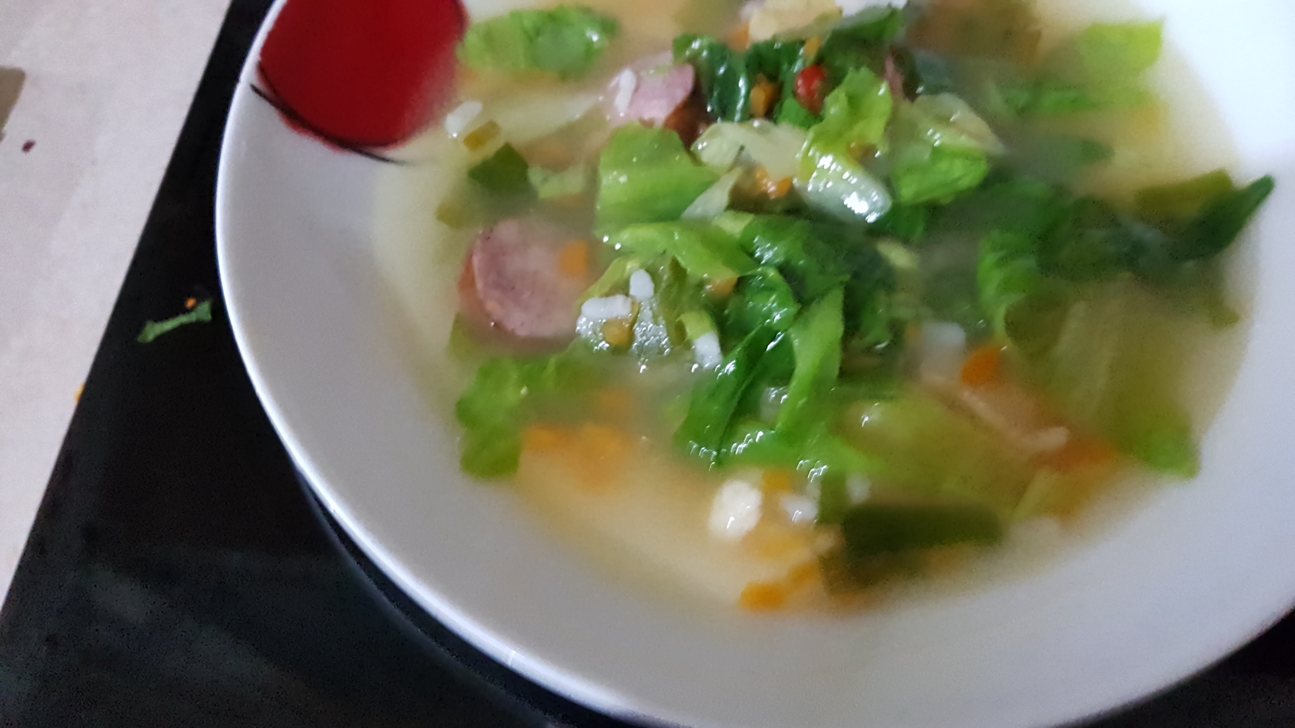 Ciorba de salata verde cu carnati  si parmezan